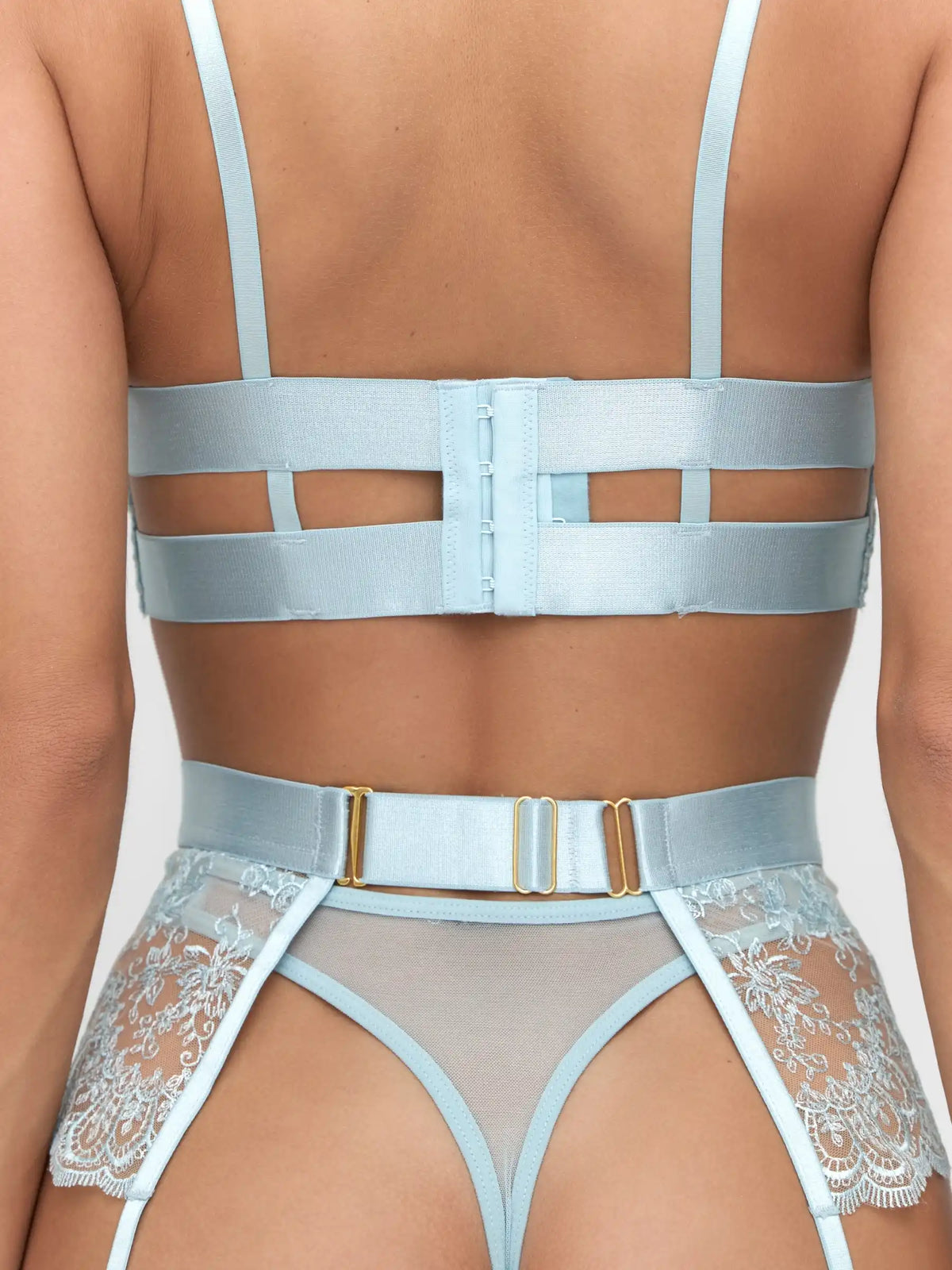 Ice blue lace bra, thong and suspender belt set with floral embroidery details